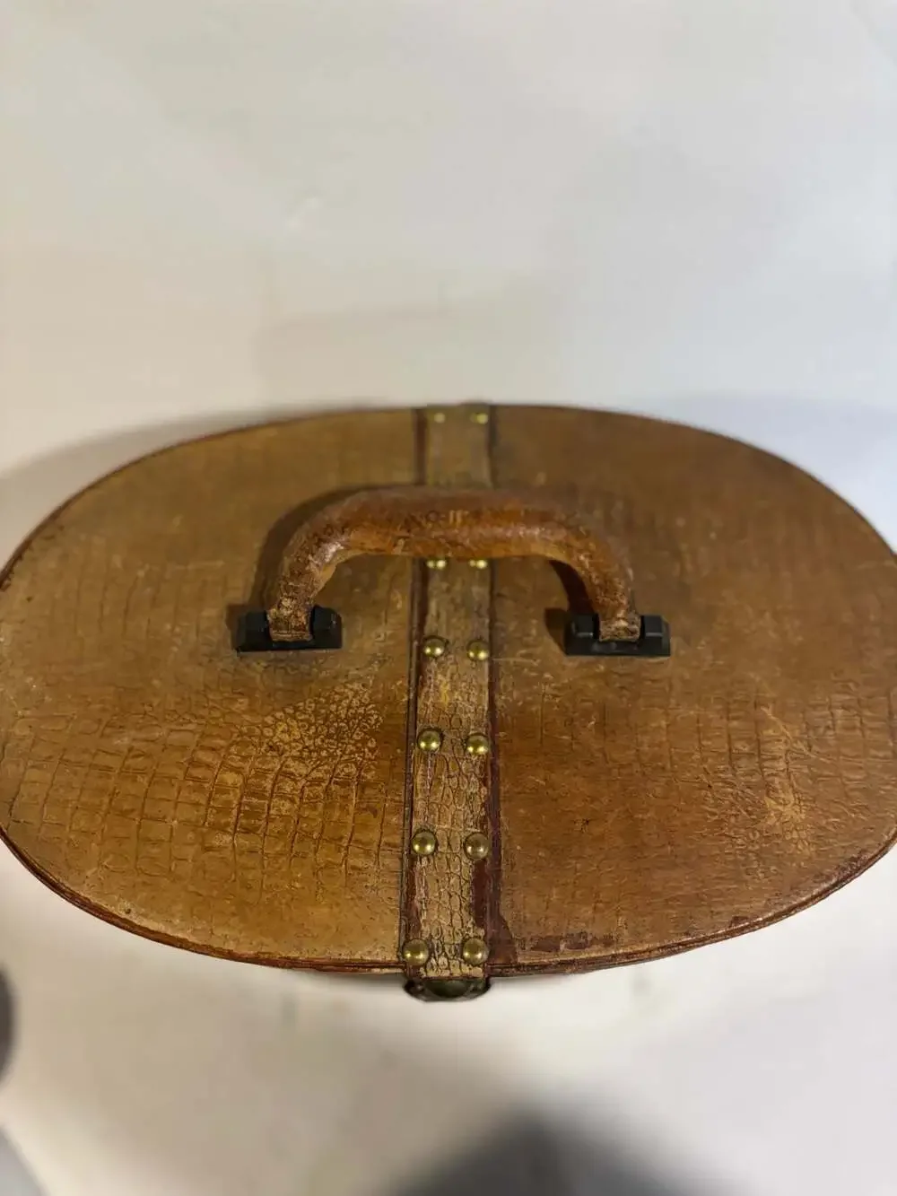 Vintage Oval Leather Hat Box with Brass Buckle and Burgundy Lining